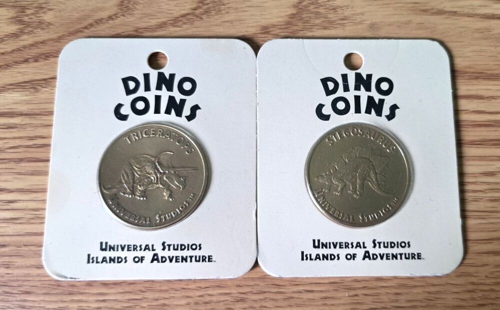 Dino Coins Universal Studios Islands of Adventure Triceratops Stegosaurus NEW